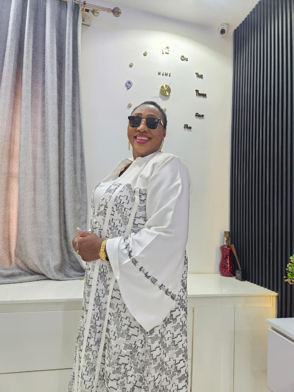 Pastor Clara Edua Emua in an elegant white outfit