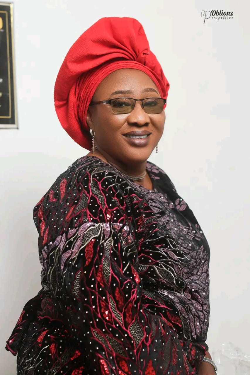 Pastor Clara Edua Emua in red and black ceremonial attire