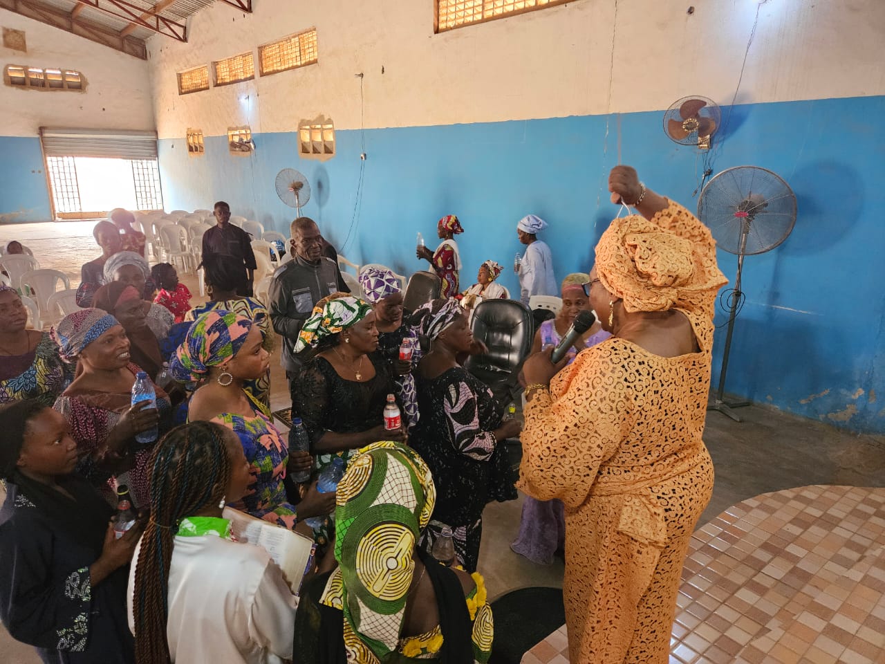 Pastor Clara speaking with members