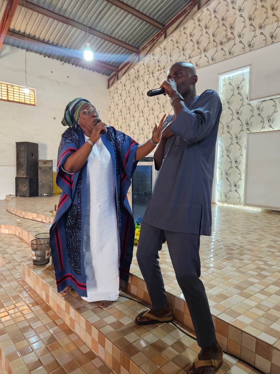 Pastor Clara ministering with a worship leader